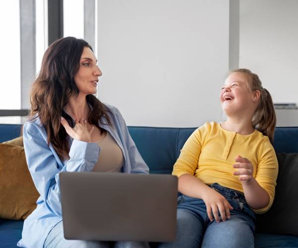 Friendly support worker from People's First Choice Australia, an NDIS Provider in Epping, assisting a client with a smile.