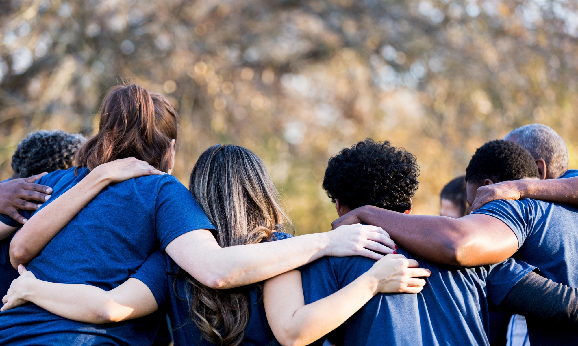Friends linking arms in unity